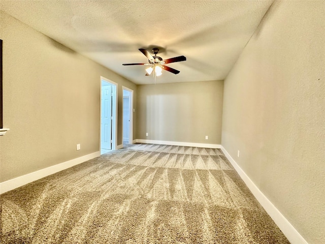 empty room with carpet, a textured ceiling, and ceiling fan