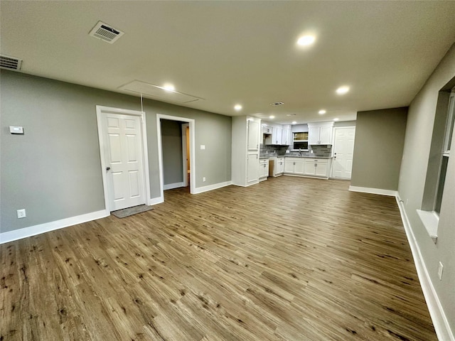 unfurnished living room featuring light wood-type flooring