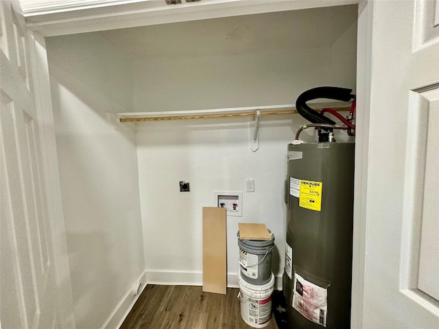 laundry area with hookup for an electric dryer, electric water heater, dark wood-type flooring, and hookup for a washing machine