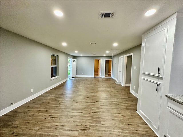 unfurnished living room featuring light hardwood / wood-style flooring