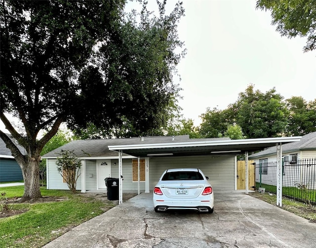 ranch-style home with a front yard and a carport