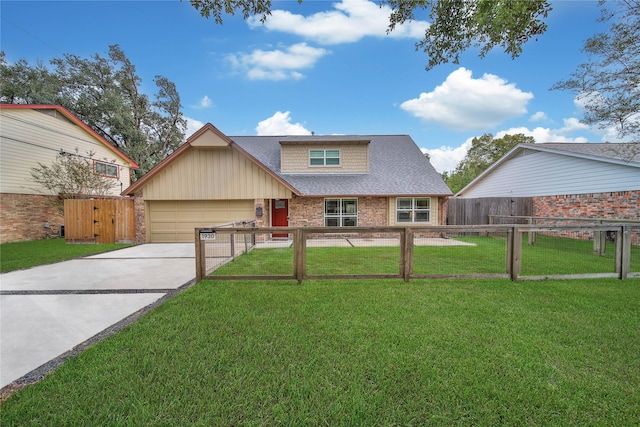 view of front of property featuring a front yard and a garage