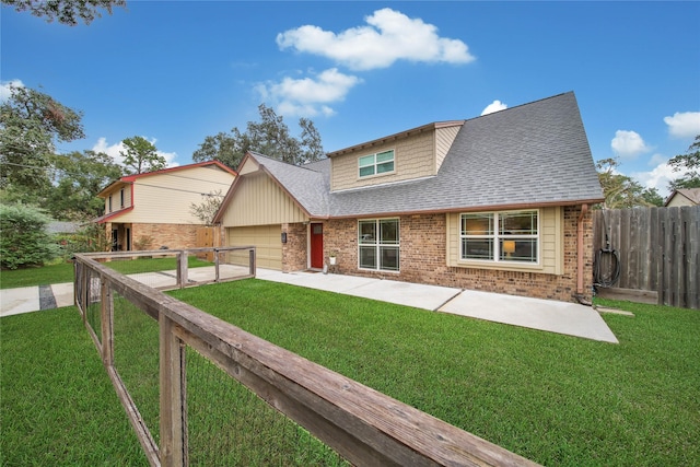 view of front facade featuring a front yard and a garage