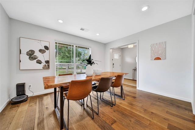 dining space featuring hardwood / wood-style flooring