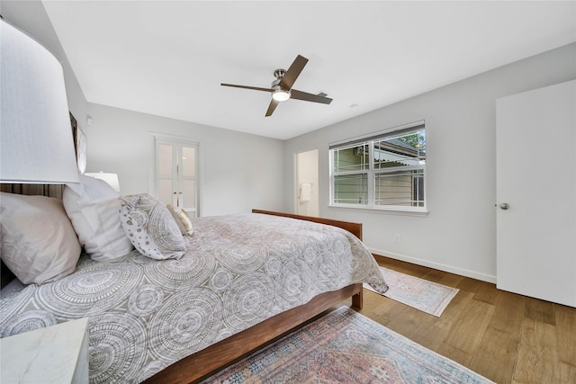 bedroom featuring ceiling fan and hardwood / wood-style floors