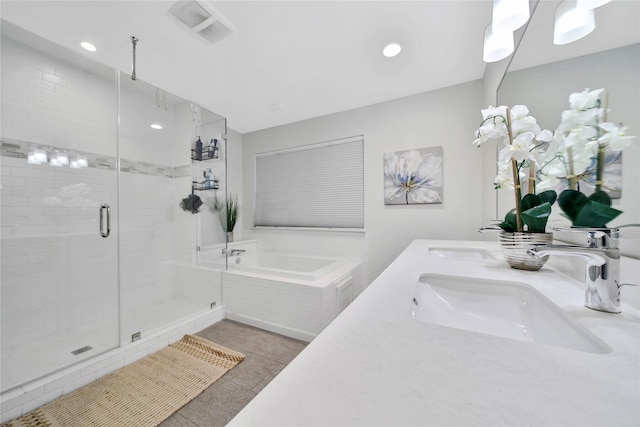 bathroom featuring plus walk in shower and vanity