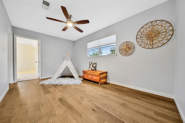 game room featuring ceiling fan and hardwood / wood-style floors