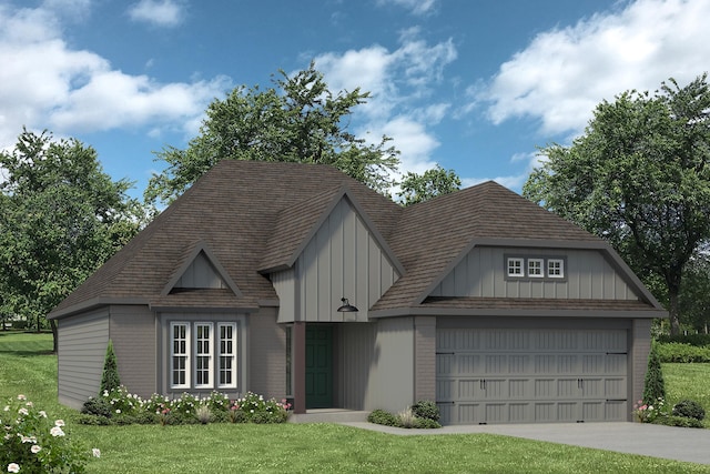 view of front of house with a front yard and a garage