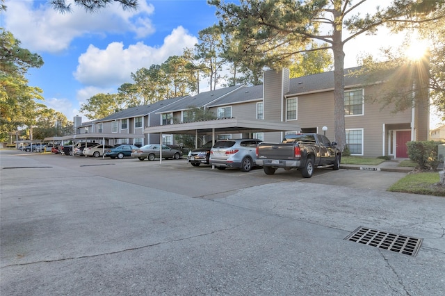 view of parking / parking lot with a carport