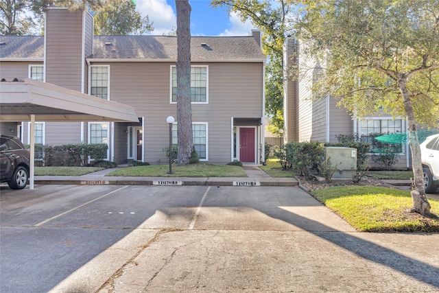 view of front of property with a carport