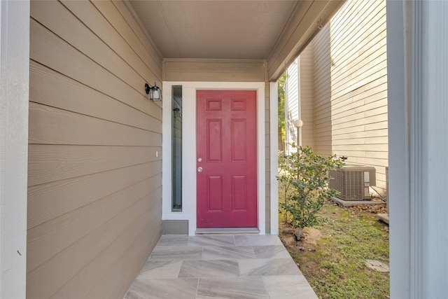 doorway to property featuring central AC