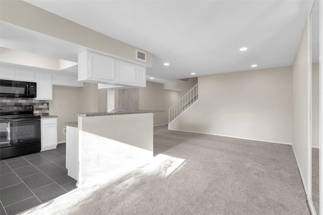 kitchen with dark carpet, light stone counters, decorative backsplash, white cabinets, and black appliances