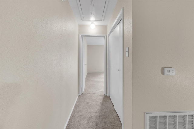 corridor featuring light carpet