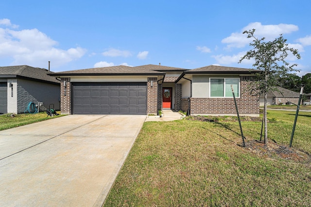 view of front of home featuring a garage and a front lawn