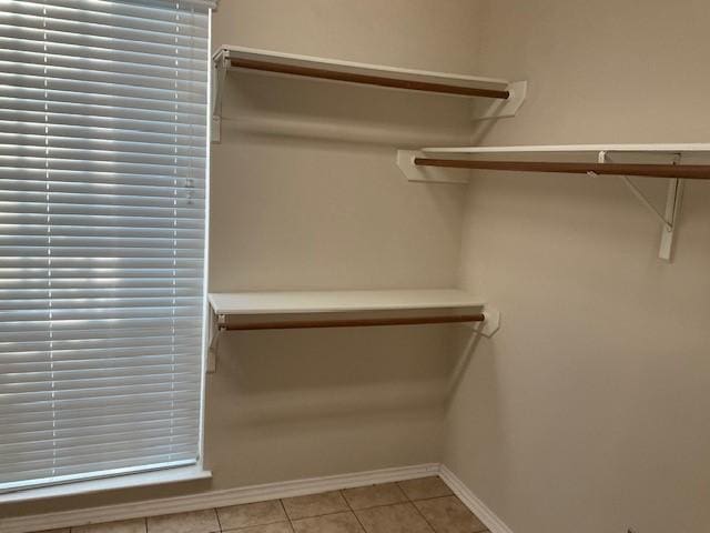 walk in closet featuring light tile patterned floors