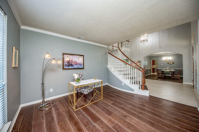 office area featuring crown molding, hardwood / wood-style floors, a textured ceiling, and an inviting chandelier