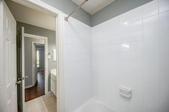 bathroom featuring tile patterned flooring, vanity, and shower / bath combination