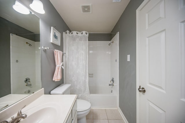 full bathroom featuring tile patterned flooring, shower / bath combination with curtain, vanity, and toilet