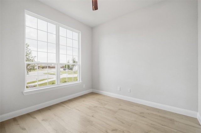 spare room featuring ceiling fan and light hardwood / wood-style flooring