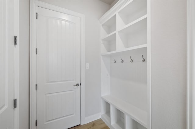 mudroom with light hardwood / wood-style floors