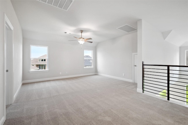 unfurnished living room featuring light carpet and ceiling fan