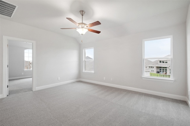 carpeted empty room featuring ceiling fan