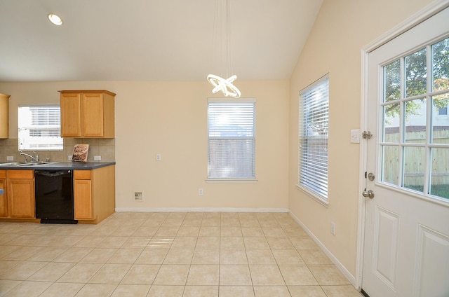 kitchen featuring backsplash, vaulted ceiling, sink, light tile patterned floors, and black dishwasher