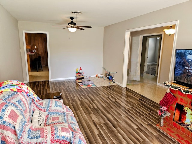 living room with dark hardwood / wood-style floors and ceiling fan