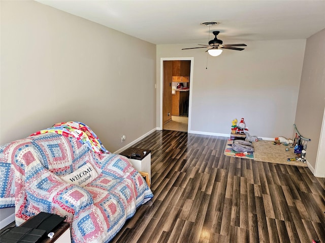 bedroom featuring ceiling fan and dark hardwood / wood-style floors