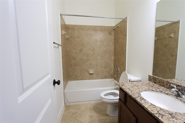 full bathroom featuring tile patterned flooring, vanity, tiled shower / bath combo, and toilet