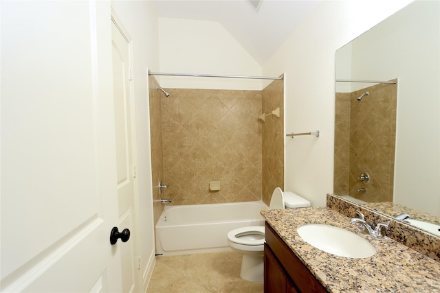 full bathroom with vanity, tile patterned floors, tiled shower / bath, vaulted ceiling, and toilet