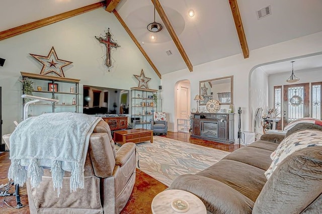 living room with beam ceiling, wood-type flooring, and high vaulted ceiling