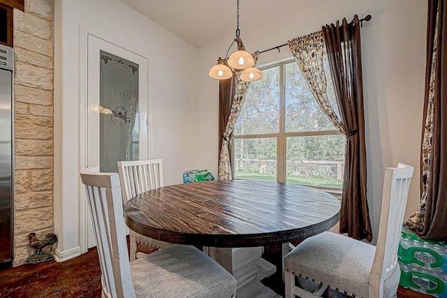 dining area featuring dark wood-type flooring