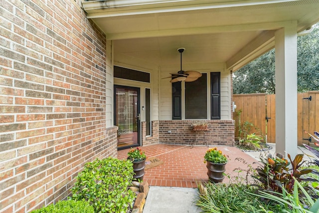 property entrance featuring a patio and ceiling fan