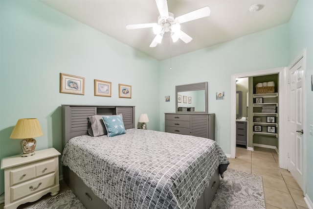 tiled bedroom with ceiling fan