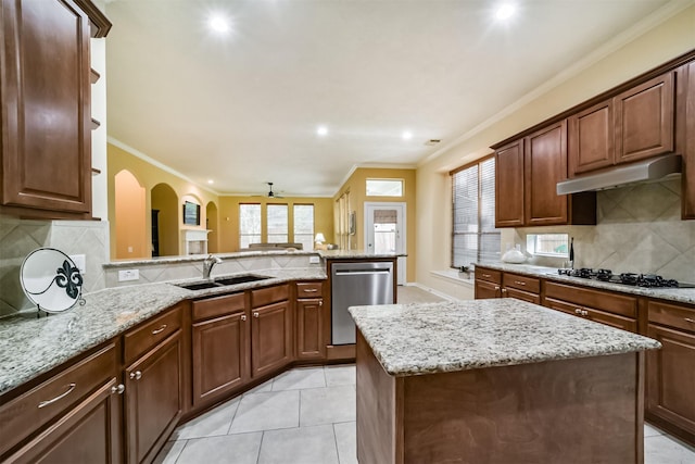 kitchen featuring a center island, sink, stainless steel dishwasher, gas stovetop, and ornamental molding