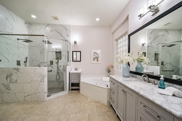 bathroom with tile patterned floors, vanity, and separate shower and tub