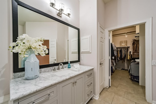 bathroom featuring tile patterned flooring and vanity