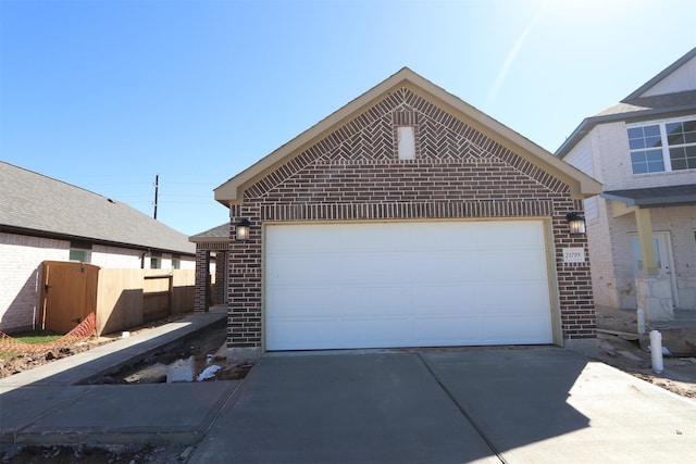 exterior space with driveway and fence