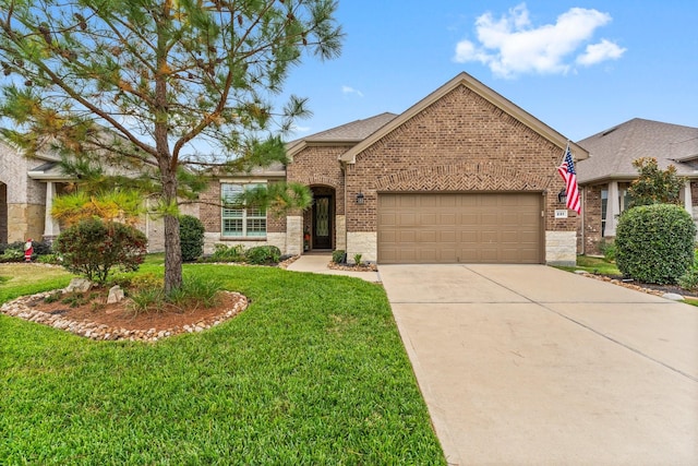 view of front of home featuring a garage and a front lawn