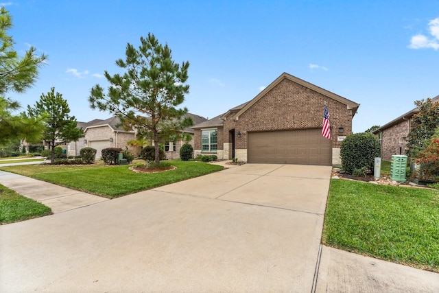 view of front facade featuring a front yard and a garage