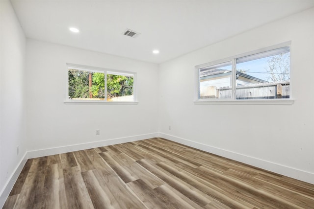 spare room featuring hardwood / wood-style floors