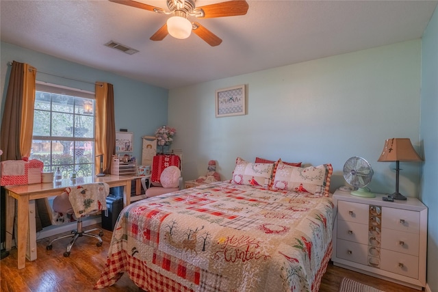 bedroom featuring hardwood / wood-style floors and ceiling fan