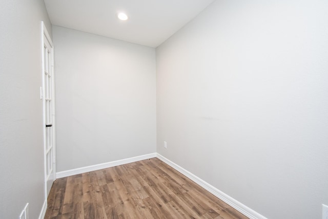 spare room with wood-type flooring