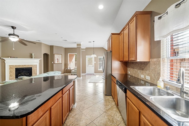 kitchen featuring tasteful backsplash, stainless steel appliances, sink, and a wealth of natural light