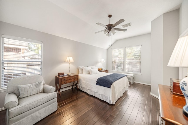 bedroom featuring dark wood-type flooring, ceiling fan, and vaulted ceiling