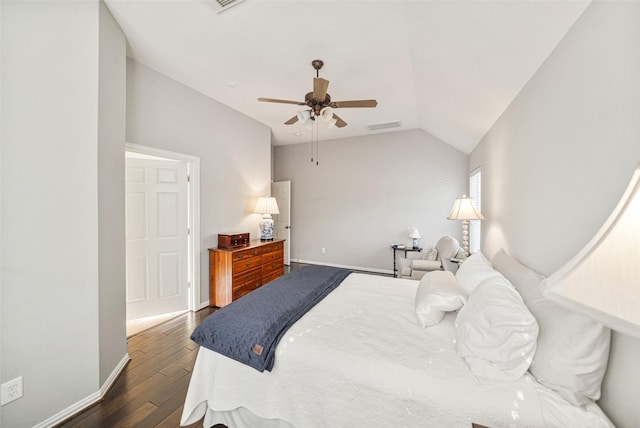 bedroom with vaulted ceiling, dark hardwood / wood-style floors, and ceiling fan