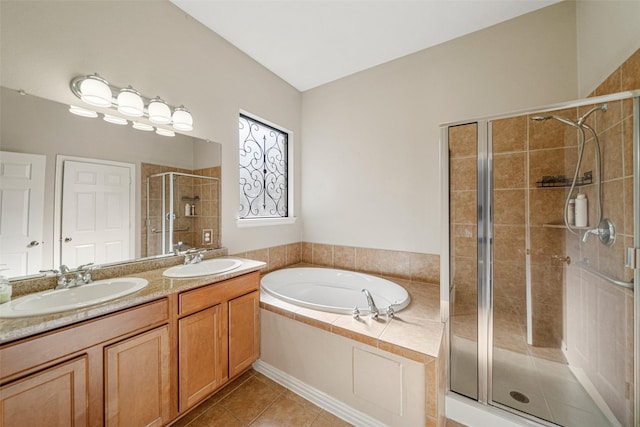 bathroom featuring tile patterned floors, shower with separate bathtub, and vanity