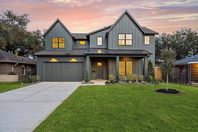 modern farmhouse with a garage and a lawn