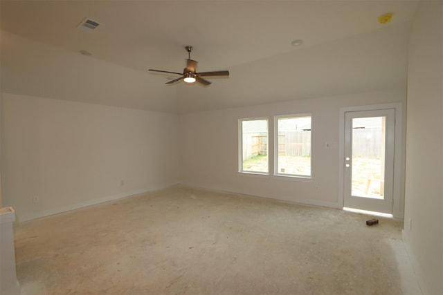 unfurnished room featuring visible vents, a ceiling fan, baseboards, and vaulted ceiling